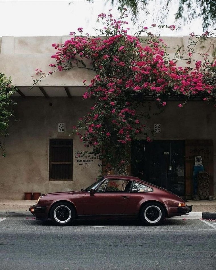 @image1 — the car: the classic burgundy rear-engine coupe, defining shape, colour and wheels only.