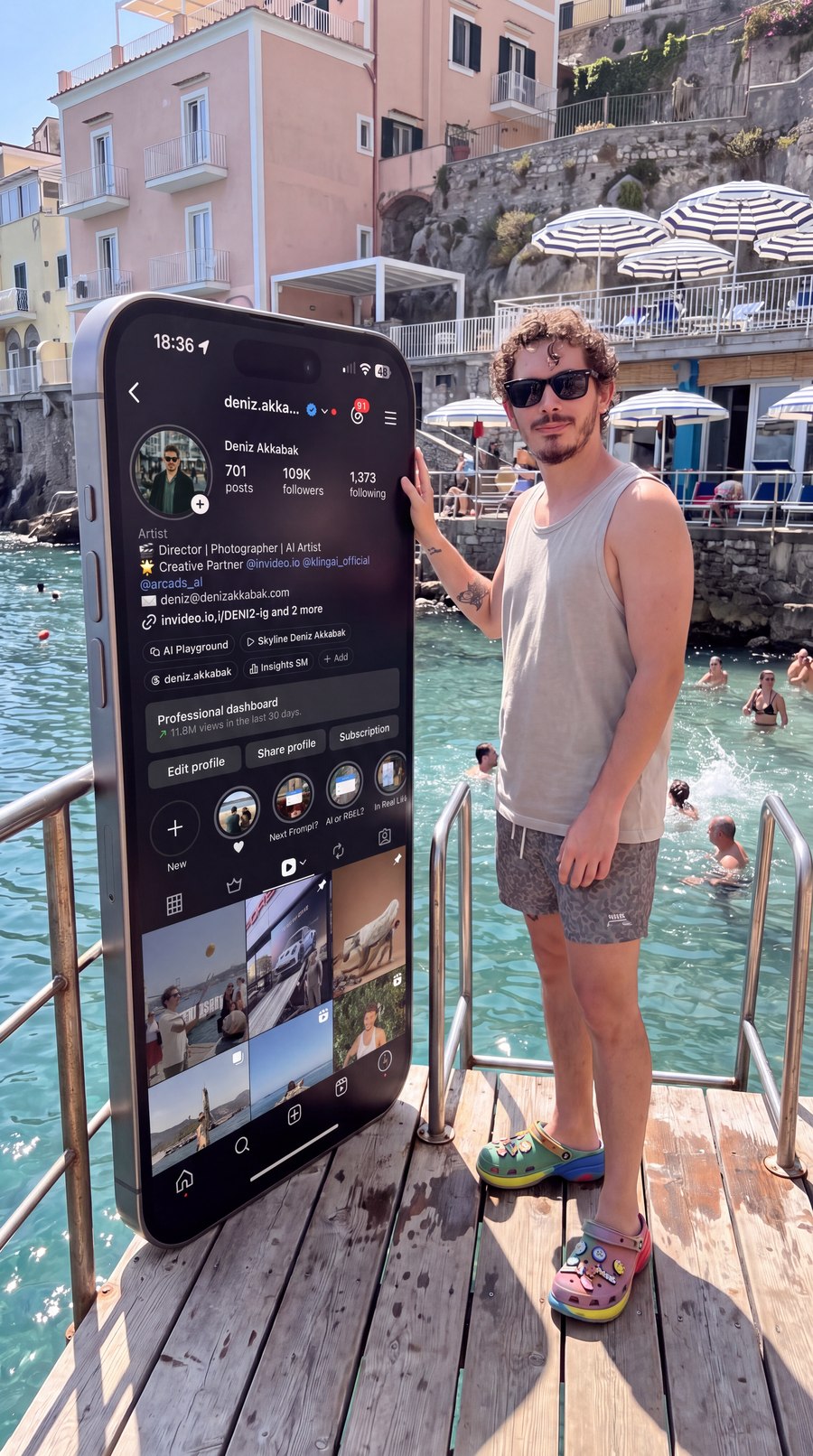 Output of Step 01 — the monolith still. Pier, railings, umbrellas, swimmers, the human-height iPhone with the profile page readable on its glass, the man leaning one palm on its edge. This becomes @Image 1 in Seedance.